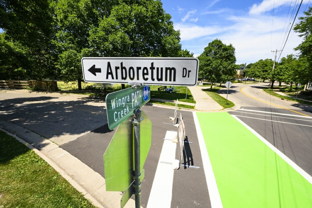 Arboretum Drive street sign at intersection with bike trail