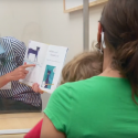 Meghan Welsh, a UW Health speech therapist, uses the new Badger Shield+ during a therapy session. By providing a full, clear view of the face, the Badger Shield+ is highly useful for health care providers who work with patients who are deaf, hard of hearing, or who need to read lips or see visual cues to better understand what others are saying. 