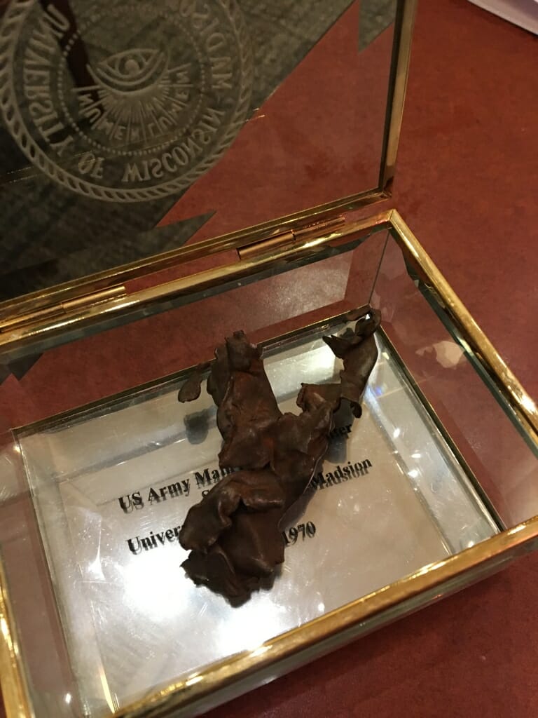 Piece of bomb debris in glass display case