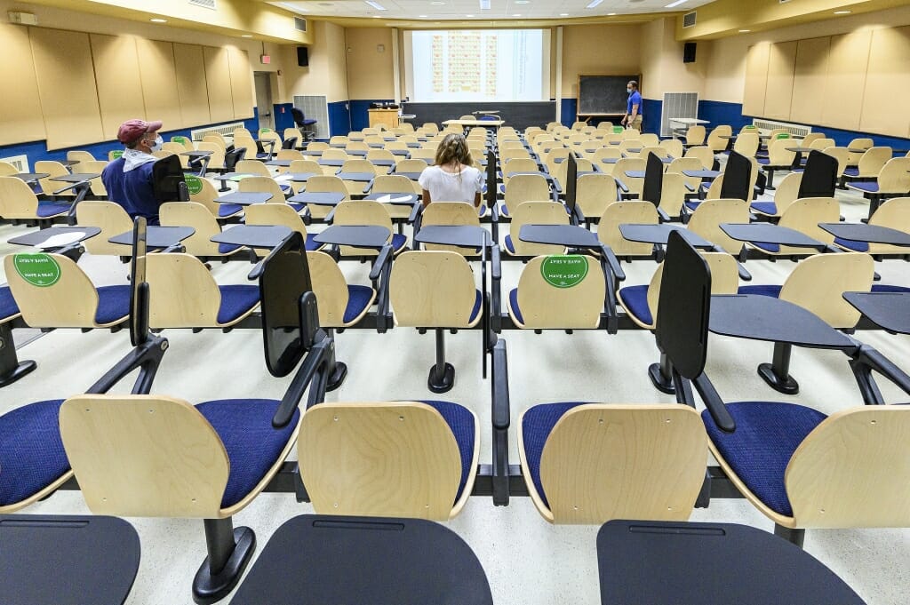 Students can sit in the spots marked with green stickers.