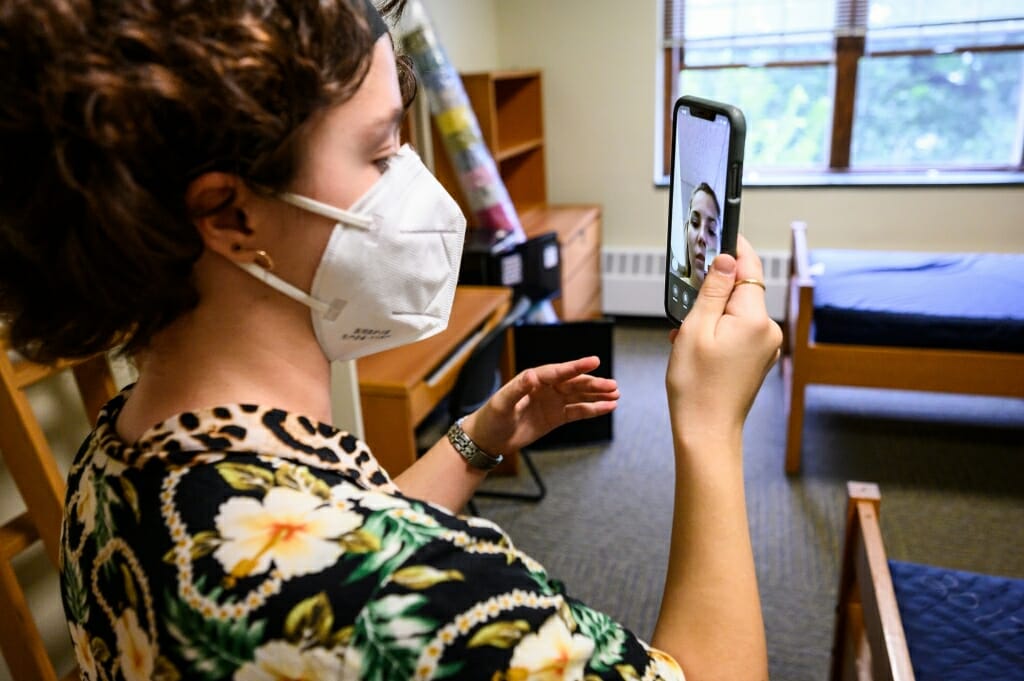 Bella Rosenberg consults with her future roommate Maggie Chrostowski via FaceTime about lofting their beds.