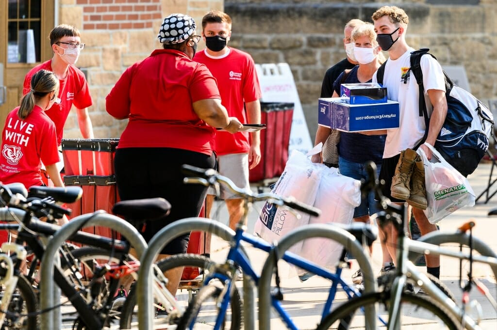 University Housing staff check in first-year  students moving in to Tripp-Adams Residence Hall.