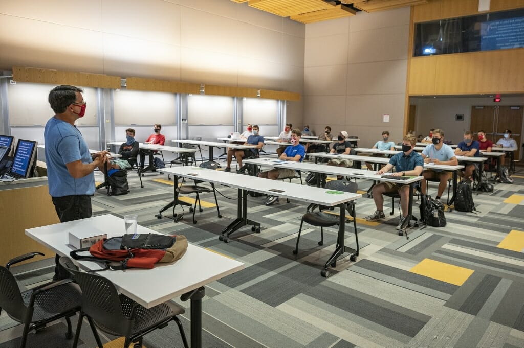 Students take part in a Manufacturing Fundamentals in-person class with faculty associate Michael De Cicco inside of the Engineering Centers Building.