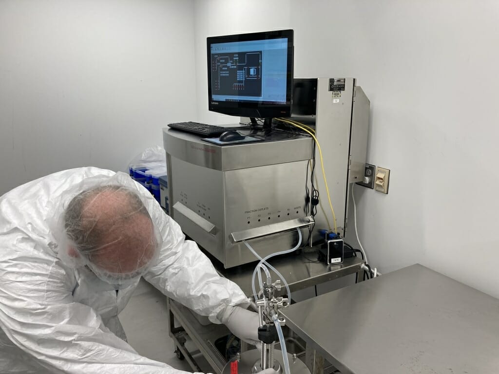 Waisman Biomanufacturing staff member Dave Richards purifies antibodies