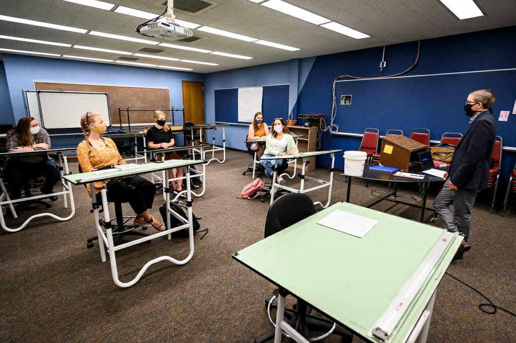 Neil Mills, assistant professor of theatre and drama, teaches a class in Vilas Hall.