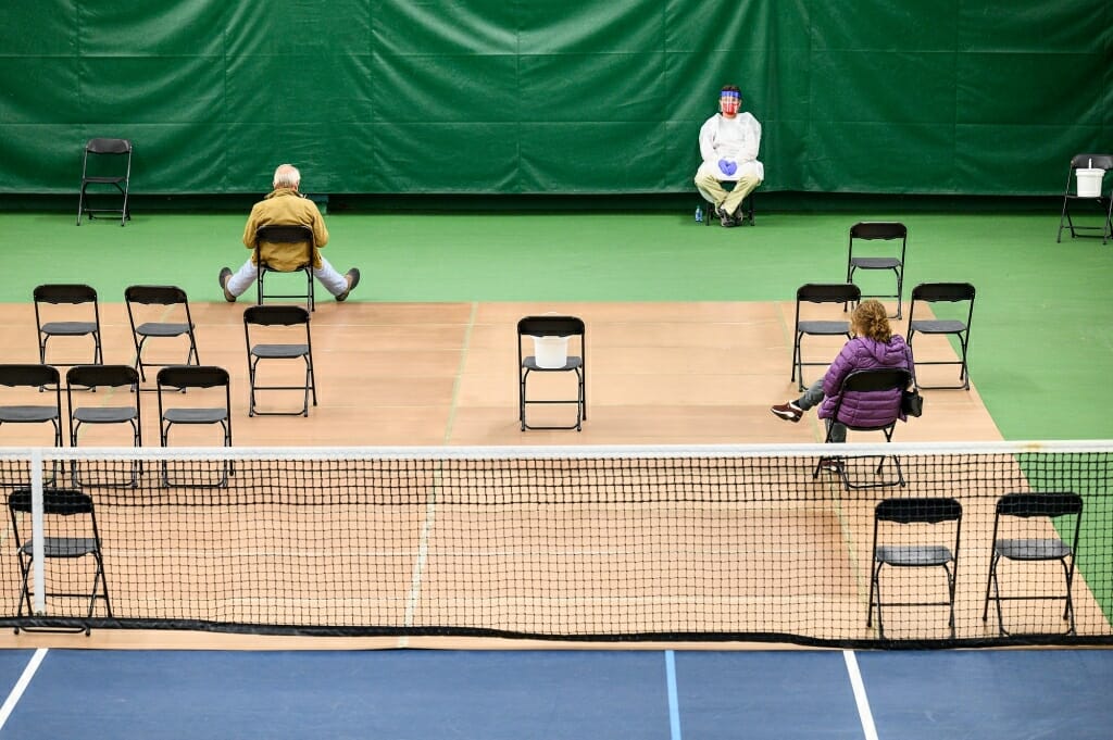 Members of the public wait for test results. The test can deliver results in as little as 15 minutes. 