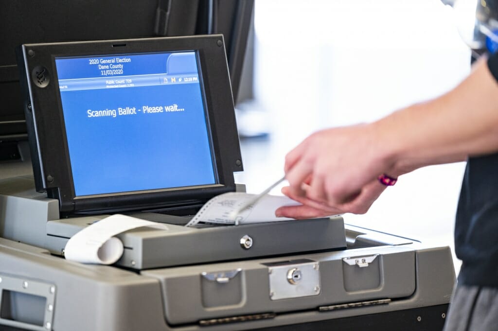 Students cast their ballots — read by a machine. — at the Chazen Museum of Art polling station.