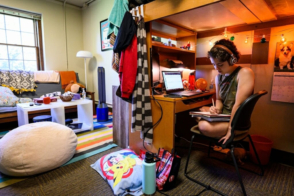 Student sitting in dorm room