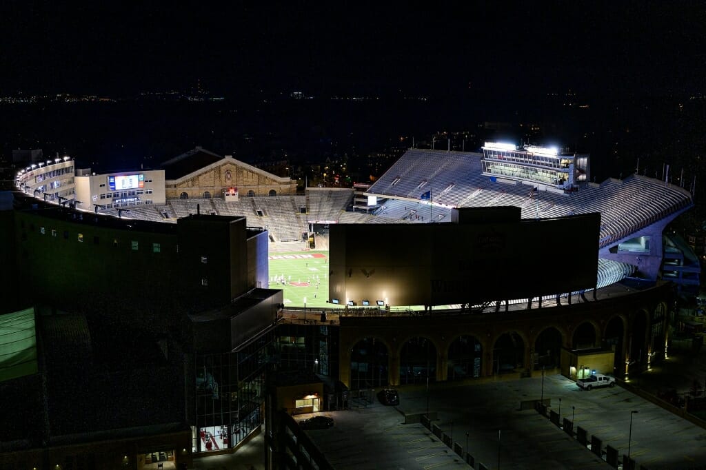 Football game with empty seats viewed from outside stadium