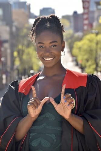 Rebekah Armstrong forming hands into a W