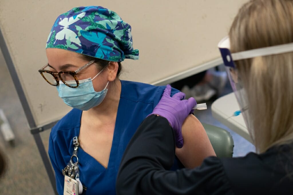 Then UW Health Nurse Mavic Tjardes, care team leader on one of University Hospitals COVID-19 units, became UW Health's second healthcare hero to receive the Pfizer COVID-19 vaccine.