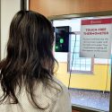 hands-free-thermometer.jpg
Using the contactless thermometer, like this one installed at a UW–Madison residence hall, requires just one person paying attention to the proximity sensor to position their forehead.