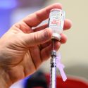 Nurses prepare measured-syringe doses of the Moderna COVID-19 vaccine as eligible Phase 1a recipients begin receiving coronavirus vaccinations at University Health Services at the University of Wisconsin-Madison on Jan. 5, 2021. This initial phase of vaccination for members of the UW-Madison community includes frontline health care workers and others in direct contact with COVID-19 patients, or in direct contact with the virus that causes COVID-19 or virus specimens. (Photo by Jeff Miller / UW-Madison)