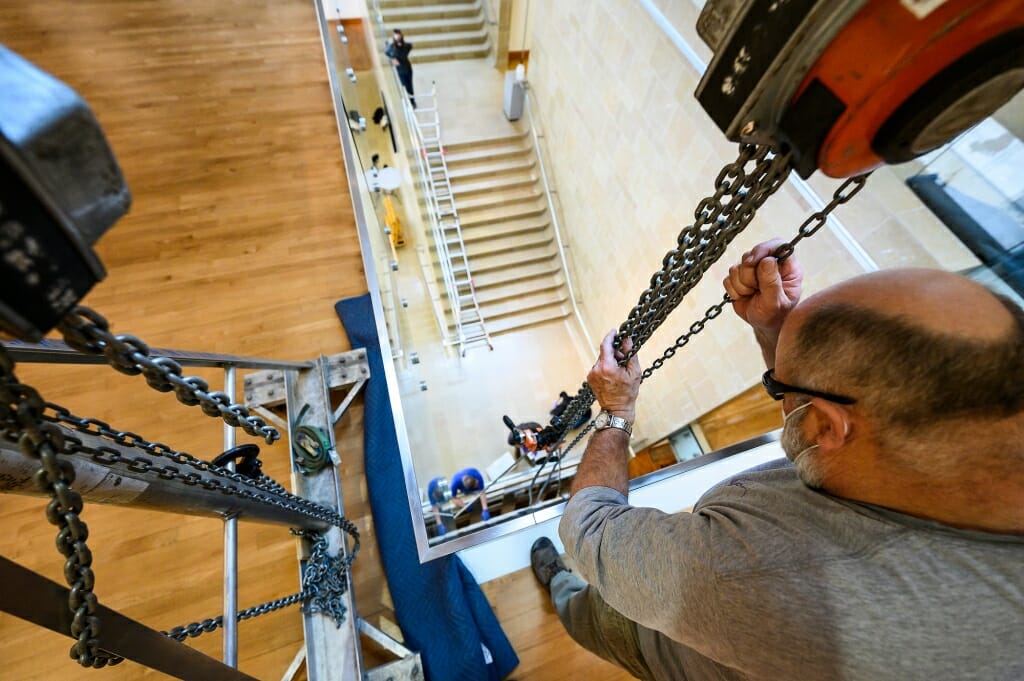 Roger Machin, with Methods & Materials Inc. of Chicago, operates the chains of the gantry.