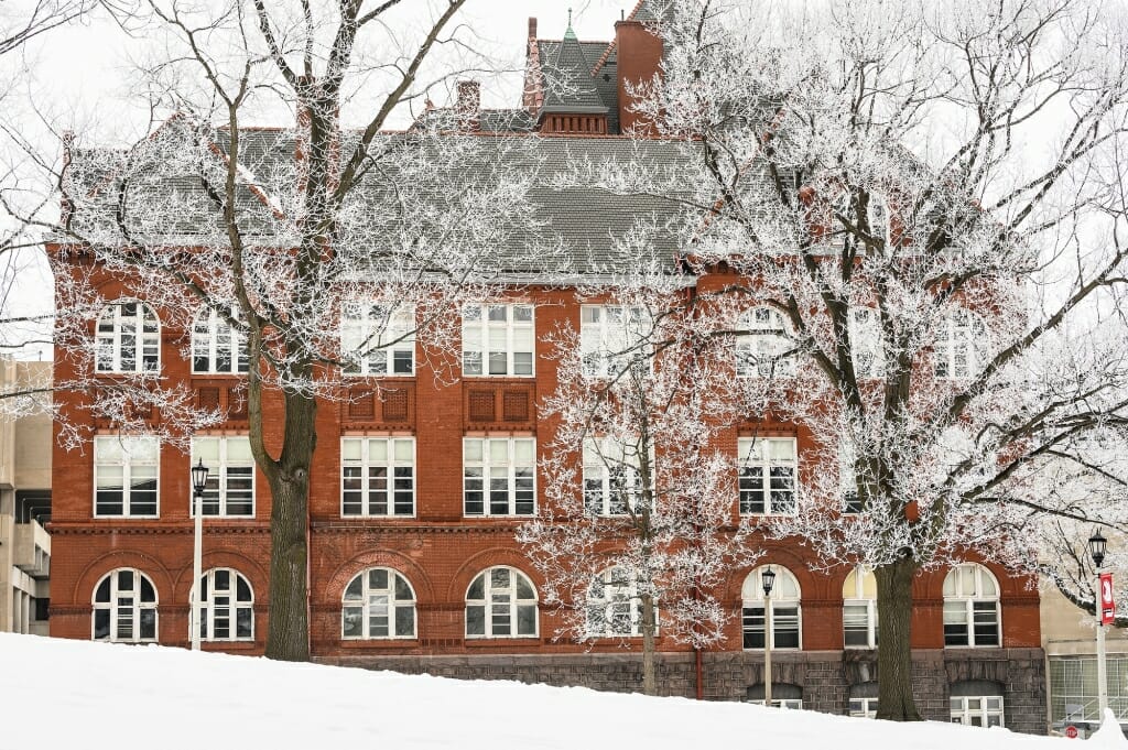 Rime ice coats the branches of trees flanking Science Hall.