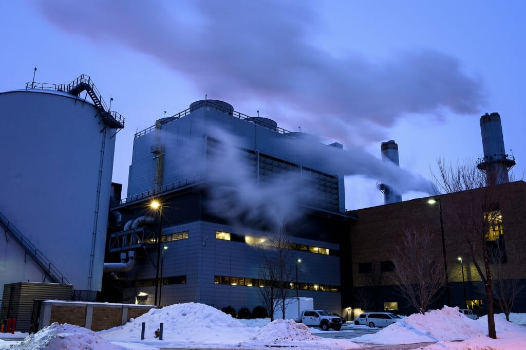 The snow-covered Charter Street Heating and Cooling Plant generates plenty of steam in the cold.