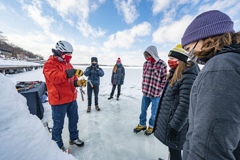 Adam Remus, Hoofers advisor, demonstrates how to use an ice screw.