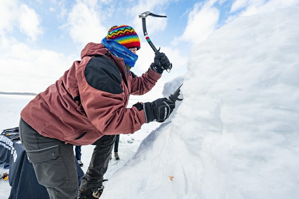 Lizz Epp, gear master for the Mountaineering Club, demonstrates how to climb ice.