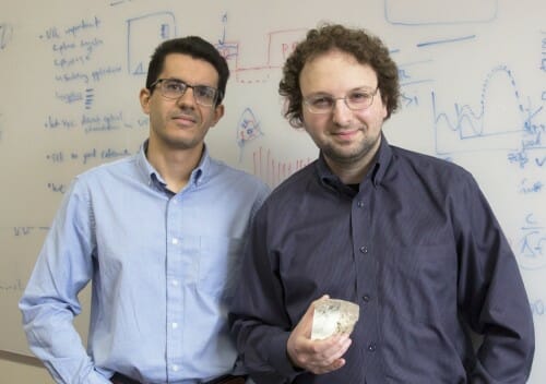 Mikhail Kats, right, and Jad Salman, standing in front of a whiteboard