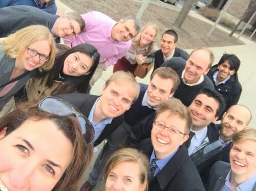 Holloway selfie with unidentified group of about a dozen people smiling