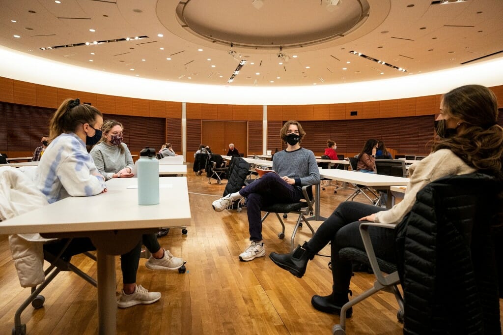 Seats in lecture halls are arranged to maintain distance between students.