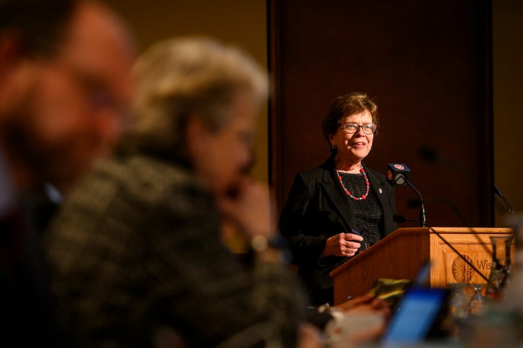 Blank speaking at a podium