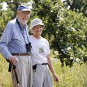 Tom and Kathie Brock walking in the prairie