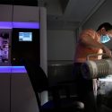 Eric Montemayor loading samples into the Thermo Scientific Talos Arctica cryo-transmission electron microscope (cryo-TEM) at the center’s secondary facility