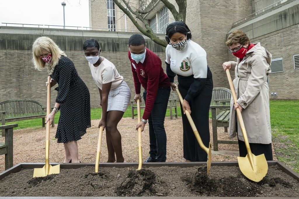 Vice Chancellor for Student Affairs Lori Reesor, undergraduates Nyla Mathis, Israel Oby and Kayla Cotton, and Chancellor Rebecca Blank hold shovels as part of a ground breaking event.