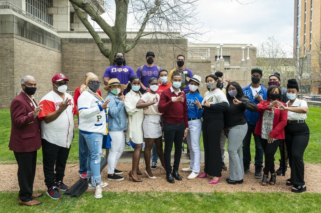 Attendees from Black Greek-letter fraternities and sororities gather during the ceremony.