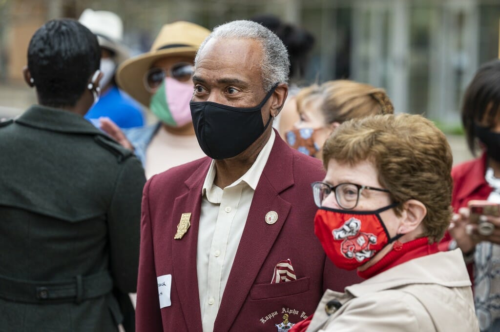 Blank speaks with Derrick Smith, director of development at The Wisconsin Institute for Discovery and a member of the Kappa Alpha Psi fraternity, during the ceremony.