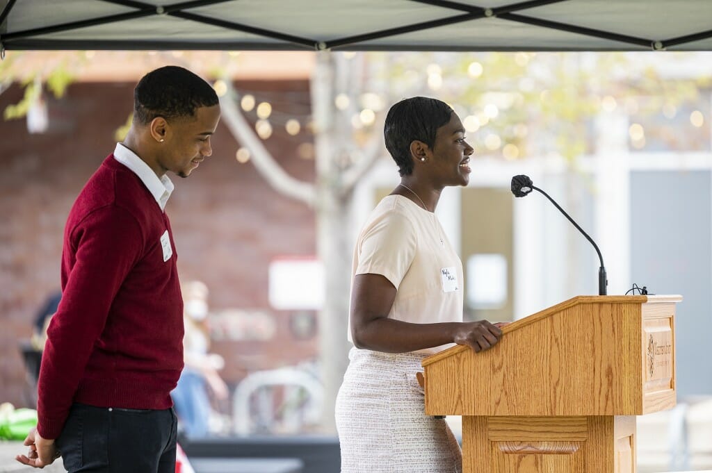 Undergraduates Nyla Mathis (right) and Israel Oby (left) address attendees.