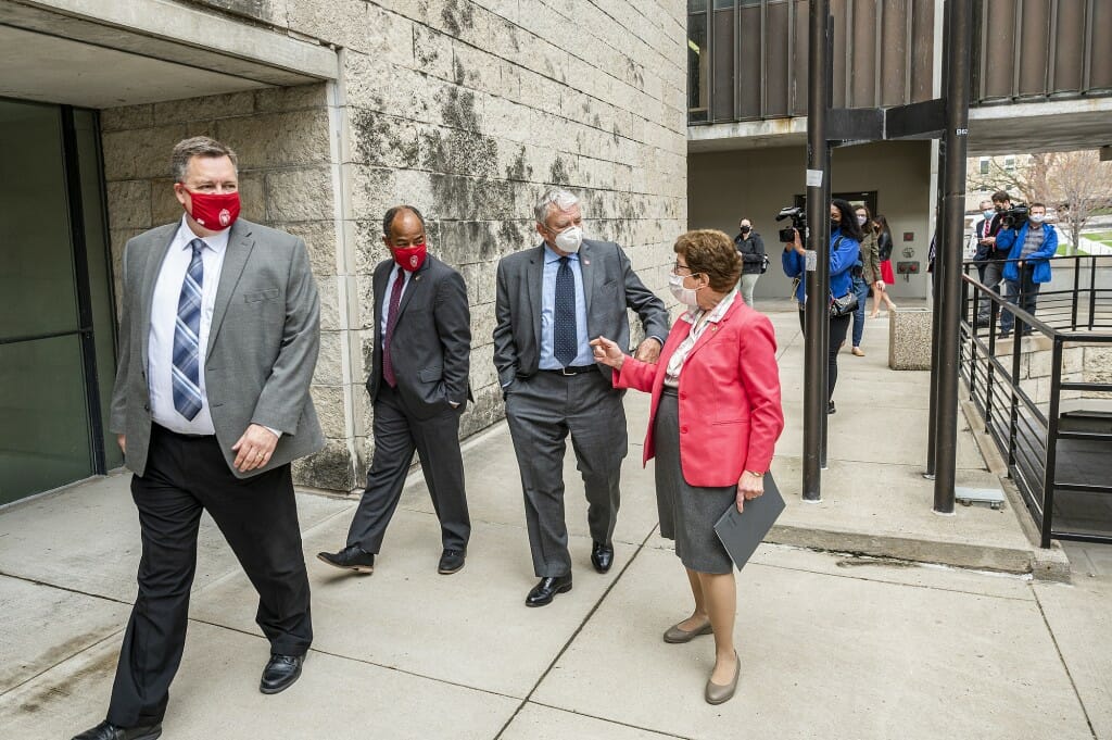 Dignitaries walking through Humanities Building