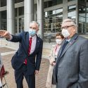 Robertson points out facets of the engineering campus toThompson and Blank during the tour.