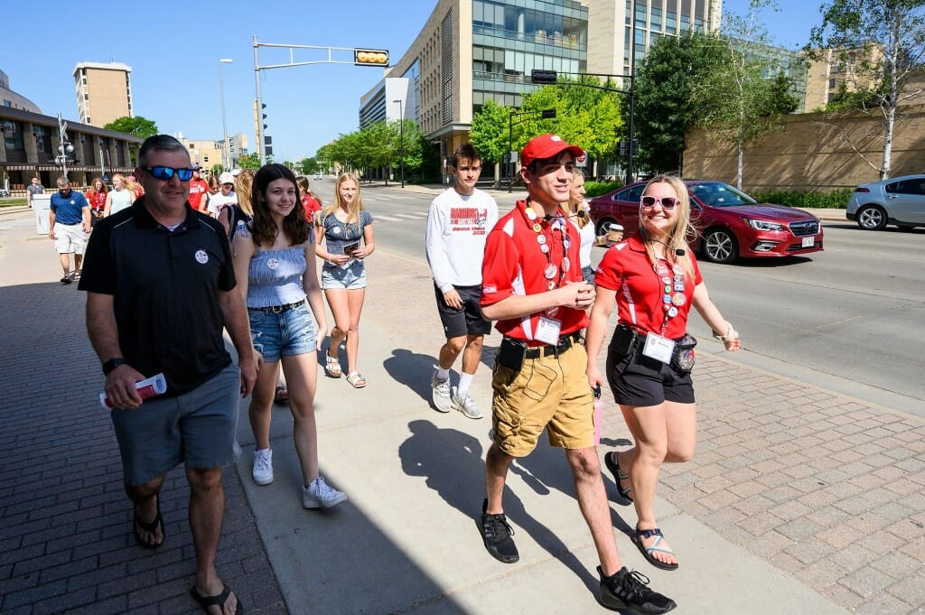 Group walking on sidewalk