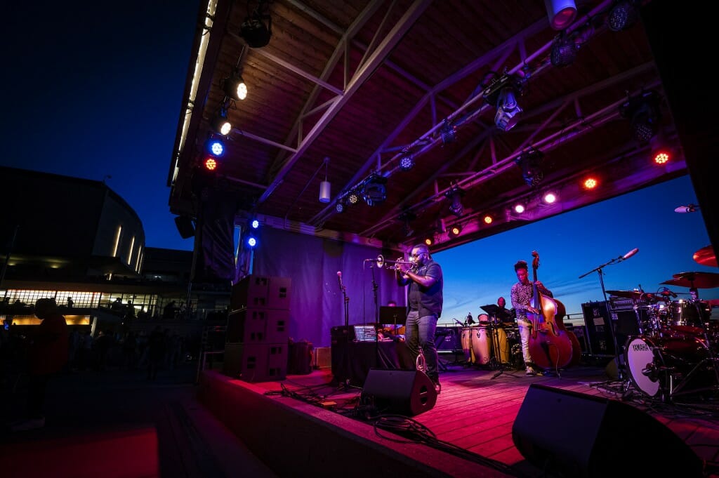 The sounds of trumpeter Marquis Hill and his band enliven the night.