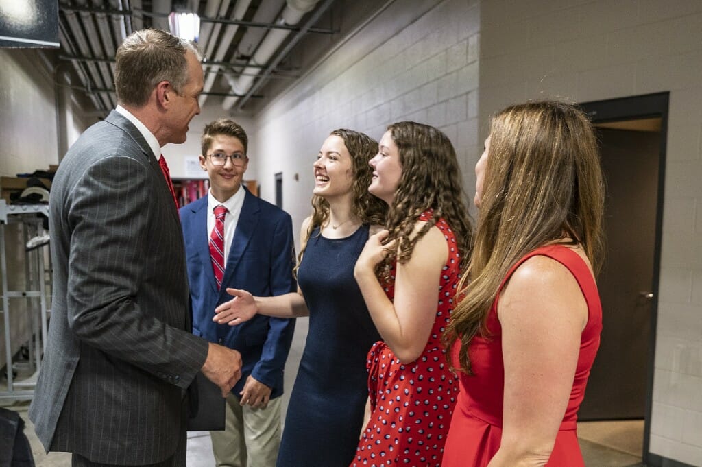 McIntosh speaks with his family prior to the press conference.