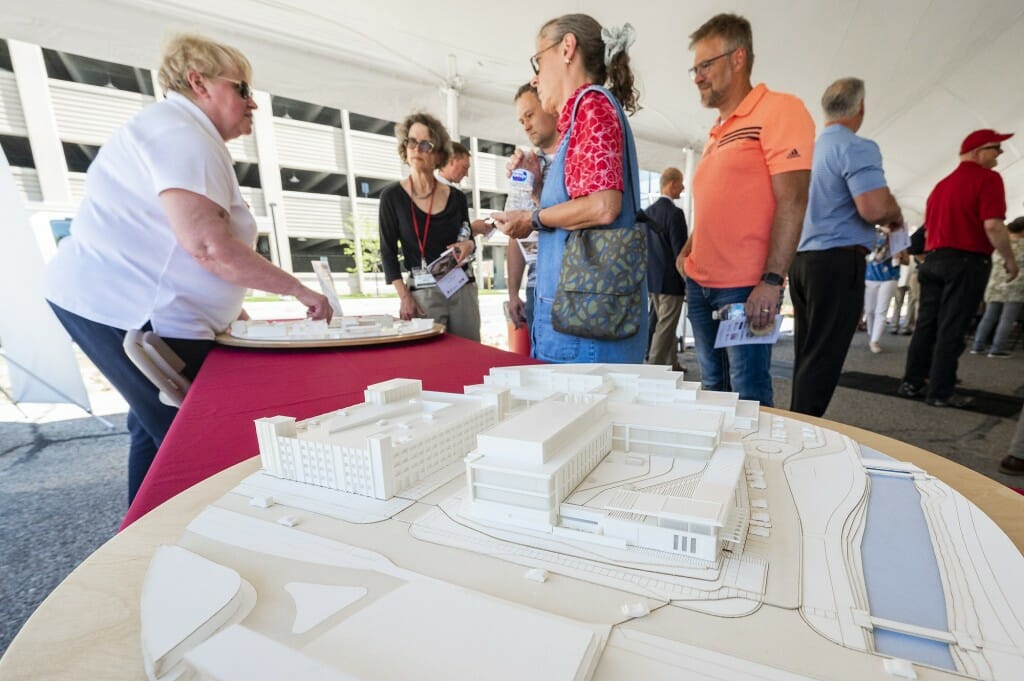 Marsha Callahan, senior development specialist in the School of Veterinary Medicine, shows off 3-D architectural models of the buildings.