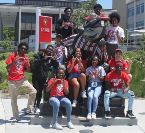 Posse Program students pose around the Bucky statue on Lake Mendota.