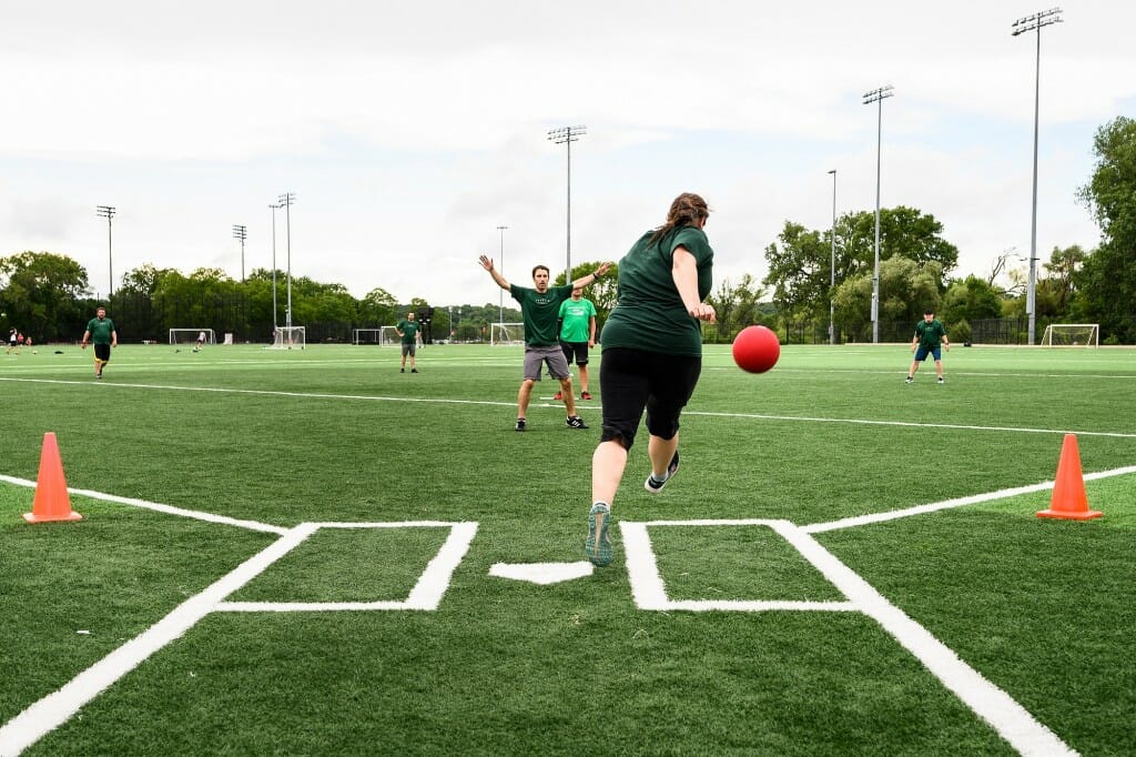 Deanna Desolver with the Office of Human Resources kicks the ball with force.