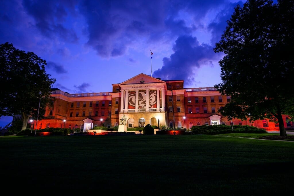 In honor of Barry Alvarez’s last day before retiring as Director of Athletics at the University of Wisconsin-Madison, red accent lighting illuminates the exterior of Bascom Hall and terrace plantings on June 30.