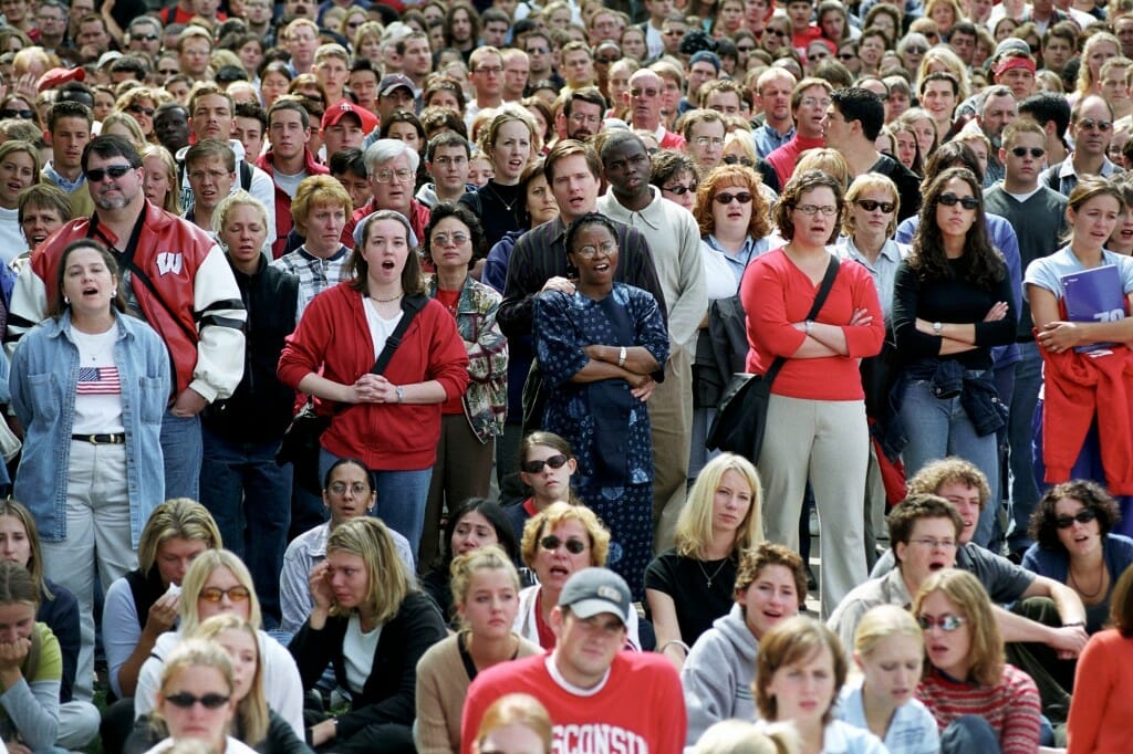 A crowd of people singing