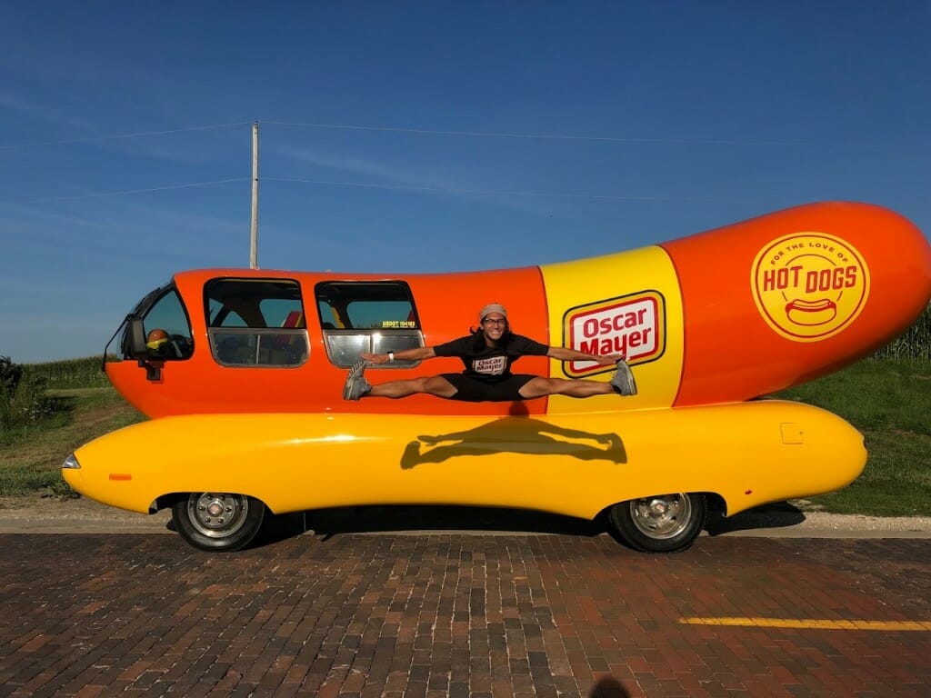 Zabat jumping in front of Wienermobile