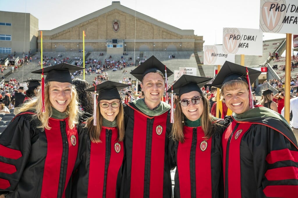 Group of grads smiling