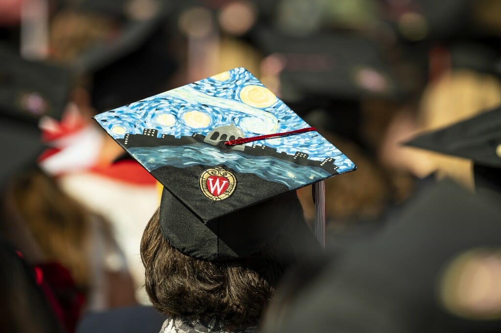 Person with mortarboard decorated with image from the painting "Starry Night"