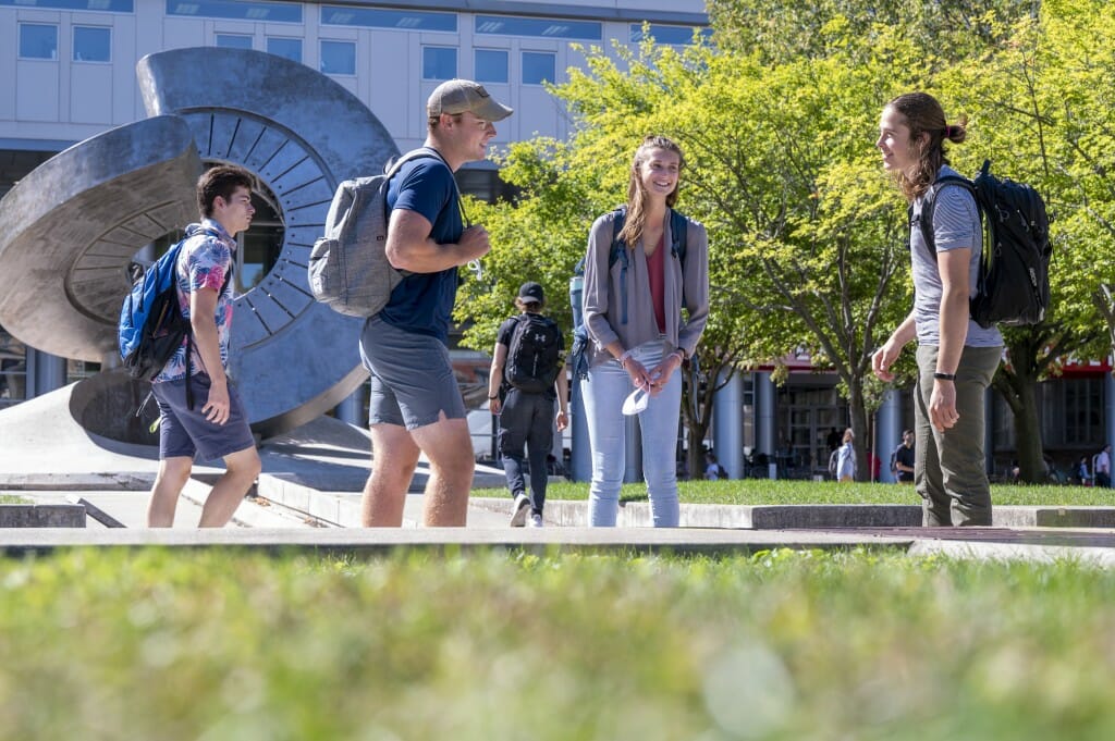 During a break between classes, Douglas McArthur, Kayla Thrane, and Ethan Seath, juniors in computer engineering, chat during the first morning of classes.