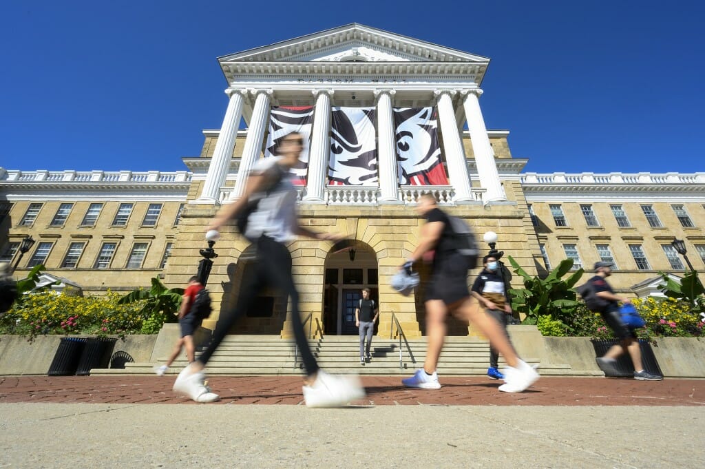 Students were greeted with a beautiful day as they walk in front of Bascom Hall during the first morning of classes for the fall semester on Sept. 8. 