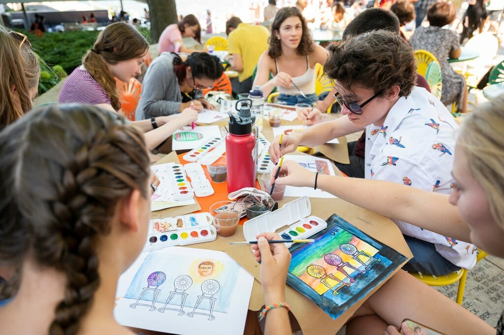 Students craft their masterpieces while enjoying the sun. The painting event was sponsored by Wheelhouse Studios at Memorial Union.