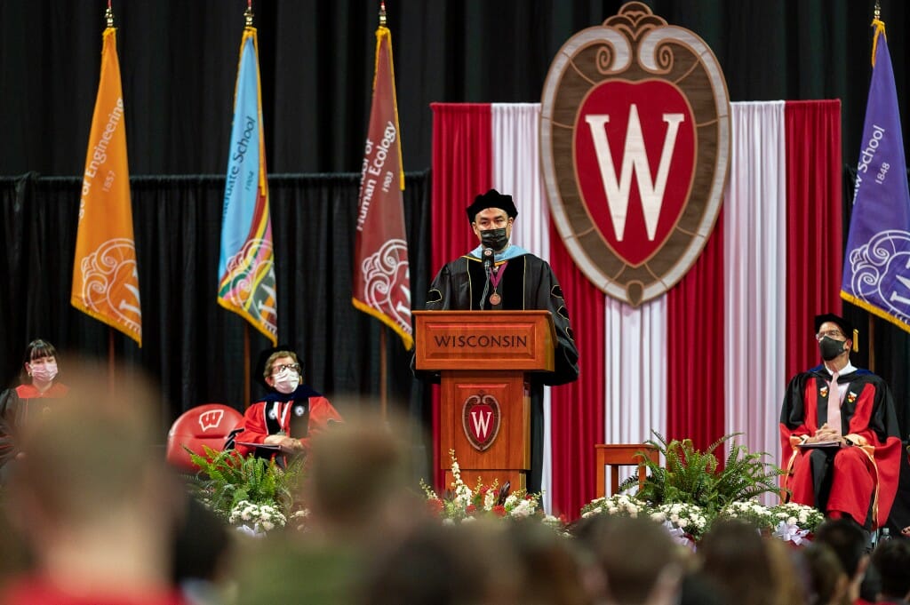 McInnes speaking at podium