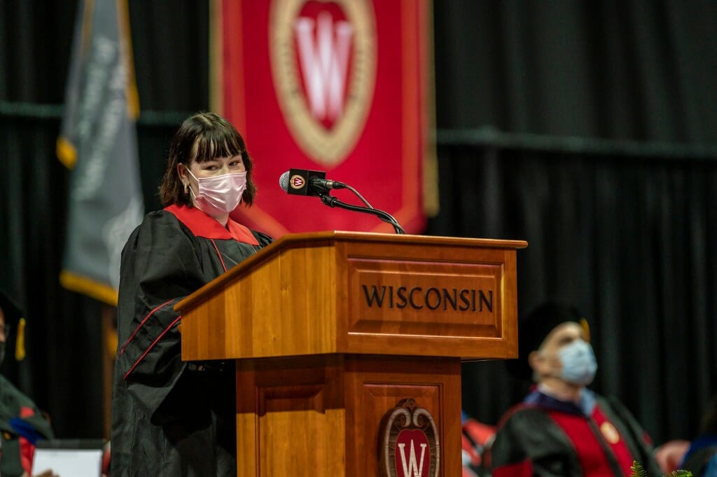 Kyla Vaughan speaking at podium